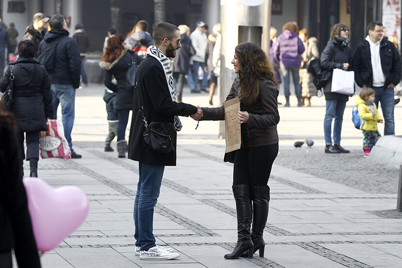 A man approaches her on the street